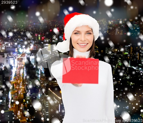 Image of woman in santa helper hat with blank red card