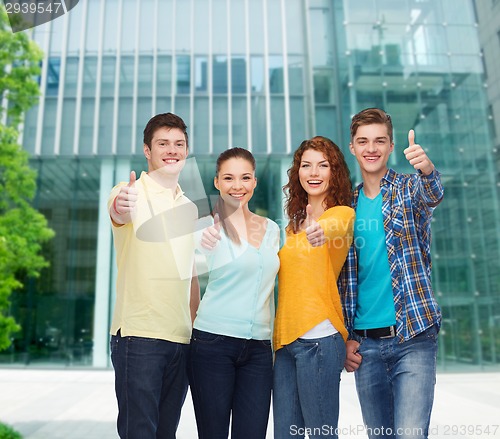 Image of group of smiling teenagers over city background