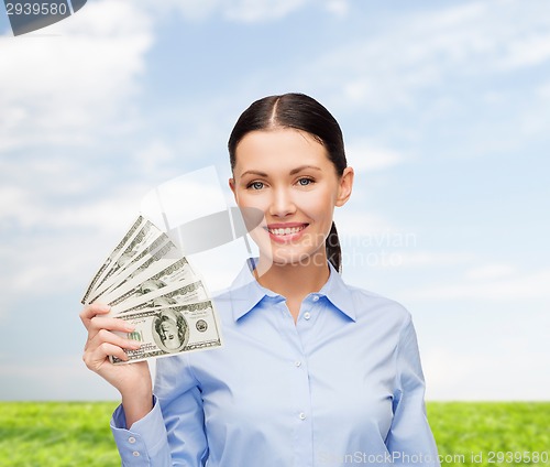 Image of businesswoman with dollar cash money