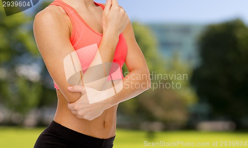 Image of sporty woman with pain in elbow