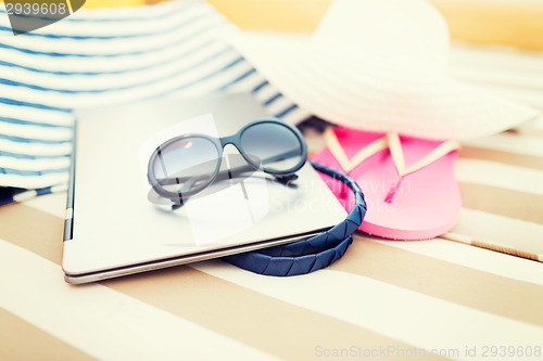 Image of close up of laptop on beach