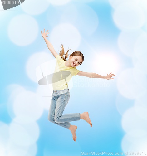 Image of smiling little girl jumping