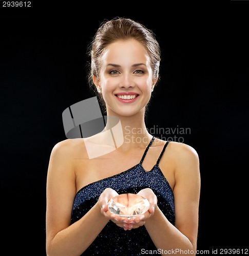 Image of smiling woman in evening dress