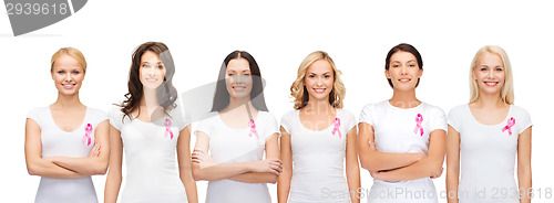 Image of smiling women with pink cancer awareness ribbons