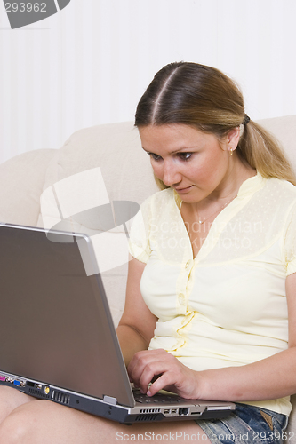 Image of young pretty woman and laptop