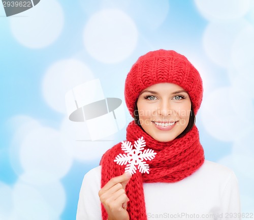 Image of smiling young woman in winter clothes