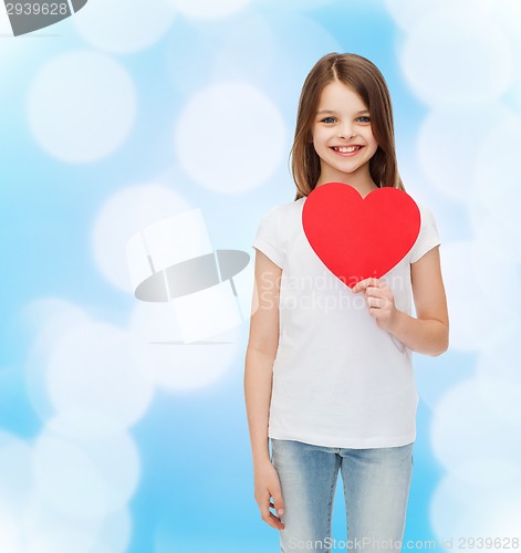 Image of beautiful little girl sitting at table