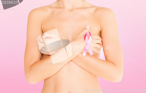 Image of naked woman with breast cancer awareness ribbon