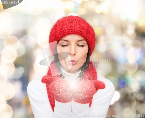 Image of smiling young woman in winter clothes