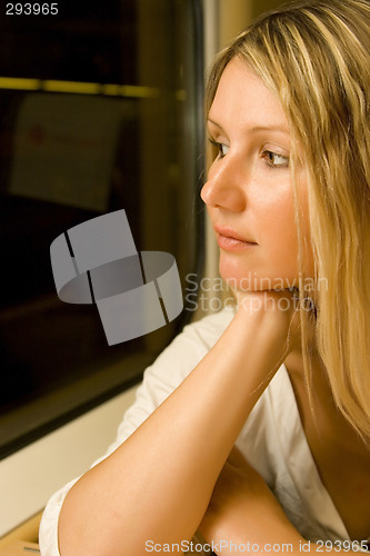 Image of young woman in vintage train