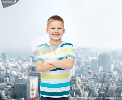 Image of little boy in casual clothes with arms crossed