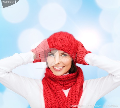 Image of smiling young woman in winter clothes