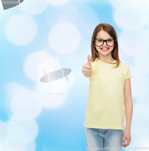 Image of smiling cute little girl in black eyeglasses