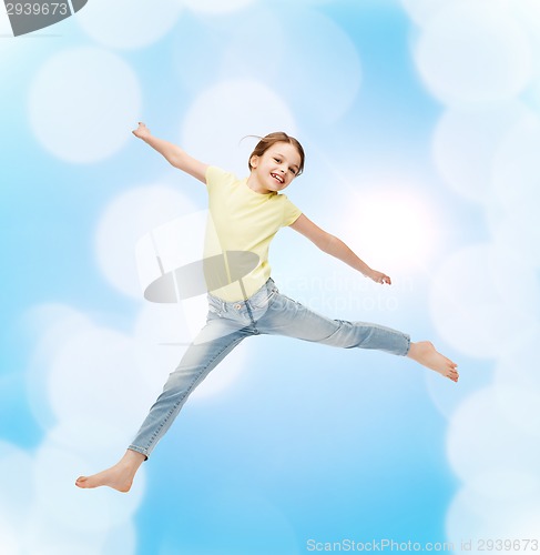 Image of smiling little girl jumping