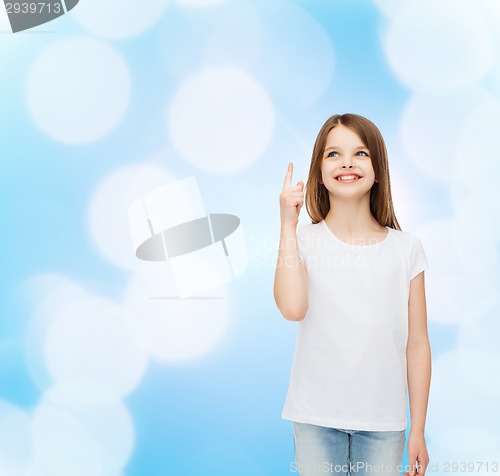 Image of smiling little girl in white blank t-shirt