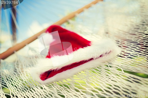 Image of picture of hammock with santa helper hat