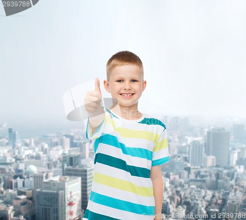 Image of little boy in casual clothes with arms crossed