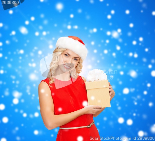 Image of smiling woman in santa helper hat with gift box