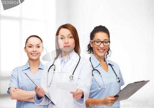 Image of calm female doctor with clipboard