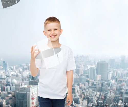 Image of smiling little boy in white blank t-shirt