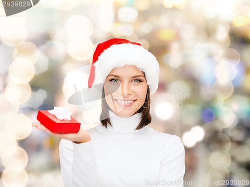 Image of smiling woman in santa helper hat with gift box