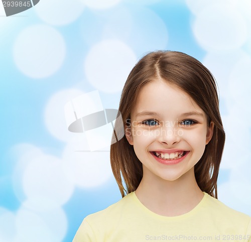 Image of smiling little girl over white background
