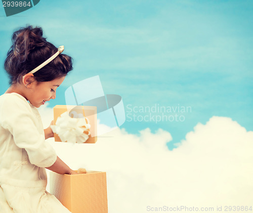 Image of happy child girl with gift box