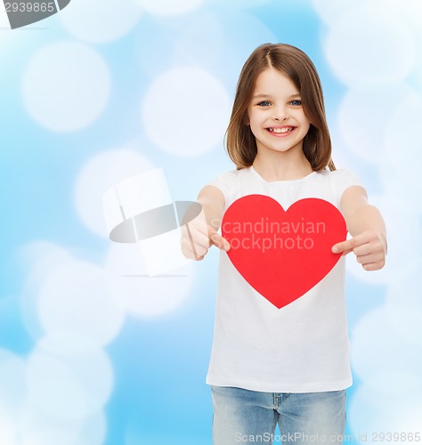 Image of beautiful little girl sitting at table