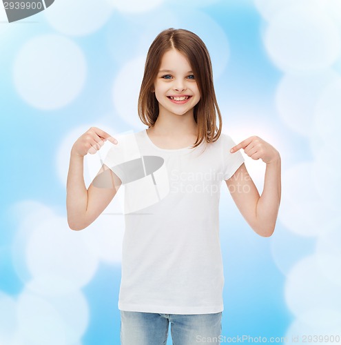 Image of smiling little girl in white blank t-shirt