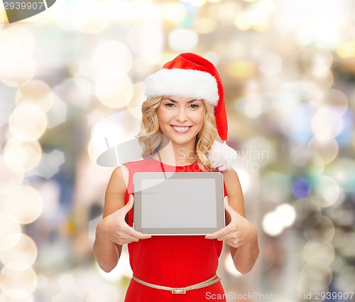 Image of woman in santa helper hat with tablet pc