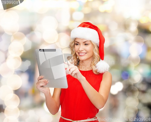 Image of woman in santa helper hat with tablet pc