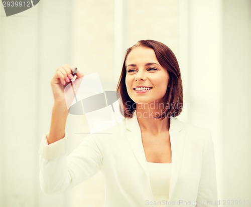Image of businesswoman writing in the air