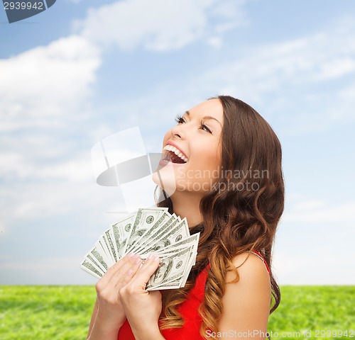 Image of woman in red dress with us dollar money