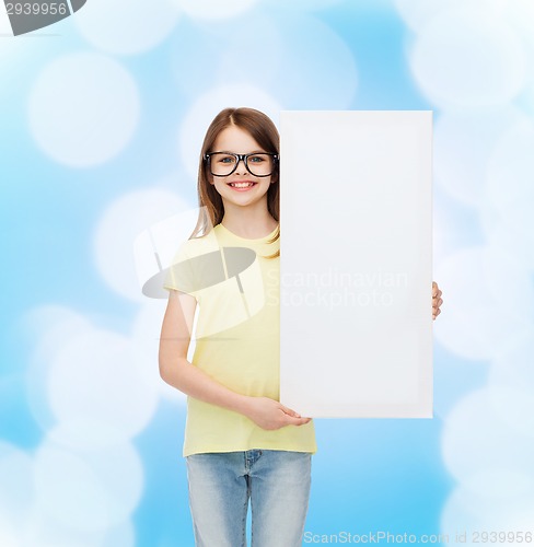 Image of little girl wearing eyeglasses with blank board