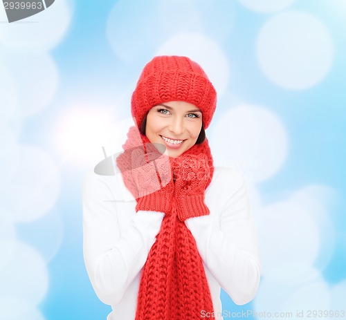 Image of smiling young woman in winter clothes