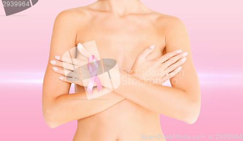 Image of naked woman with breast cancer awareness ribbon