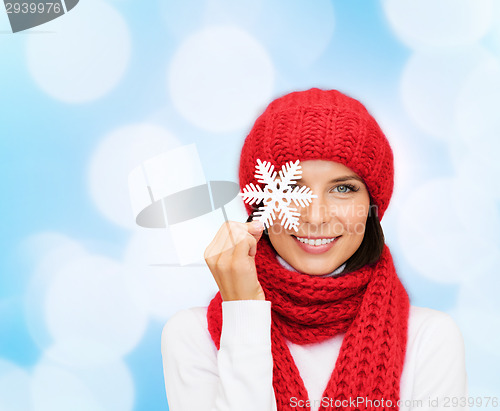 Image of smiling young woman in winter clothes