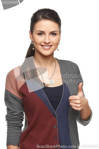 Image of Woman in cardigan gesturing thumb up