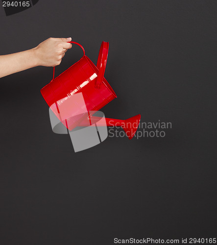 Image of Holding a watering can