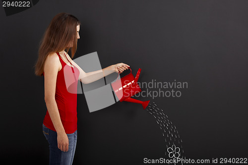 Image of Watering a flower