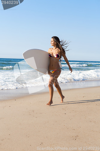 Image of Surfer girl at the beach