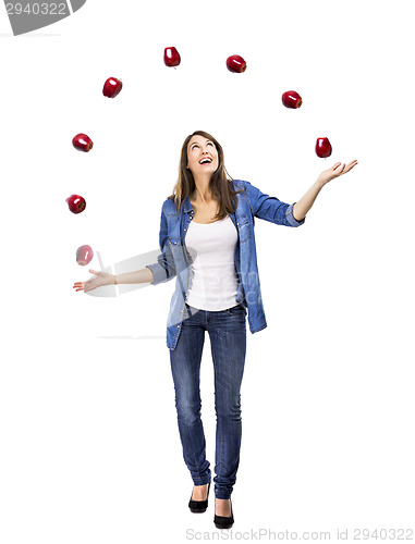 Image of Woman throwing apples