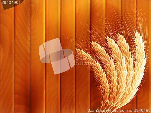 Image of Wheat on wooden autumn background. EPS 10