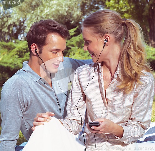 Image of couple listening player 