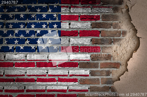 Image of Dark brick wall with plaster - USA
