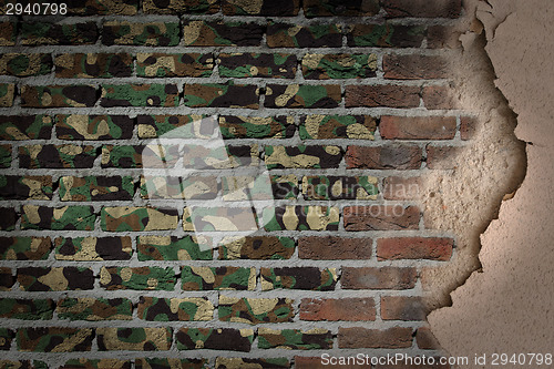 Image of Dark brick wall with plaster - Army camouflage