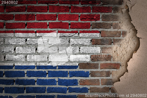 Image of Dark brick wall with plaster - Netherlands