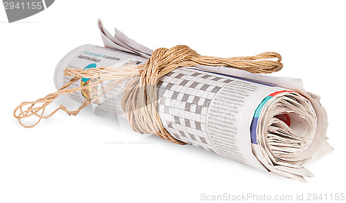 Image of Roll Of Newspapers Tied With A Rope