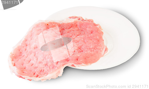 Image of Raw Pork Schnitze On A White Plate