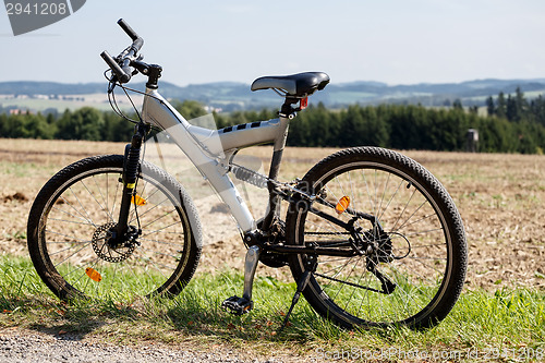 Image of bike parked in a meadow